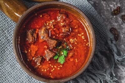 lamb curry dish with onions, garlic, turmeric and tomato sauce